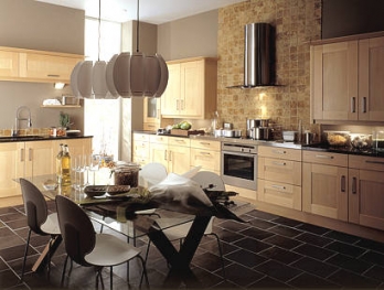 Baltic Maple kitchen with a glass dining table and slate floor